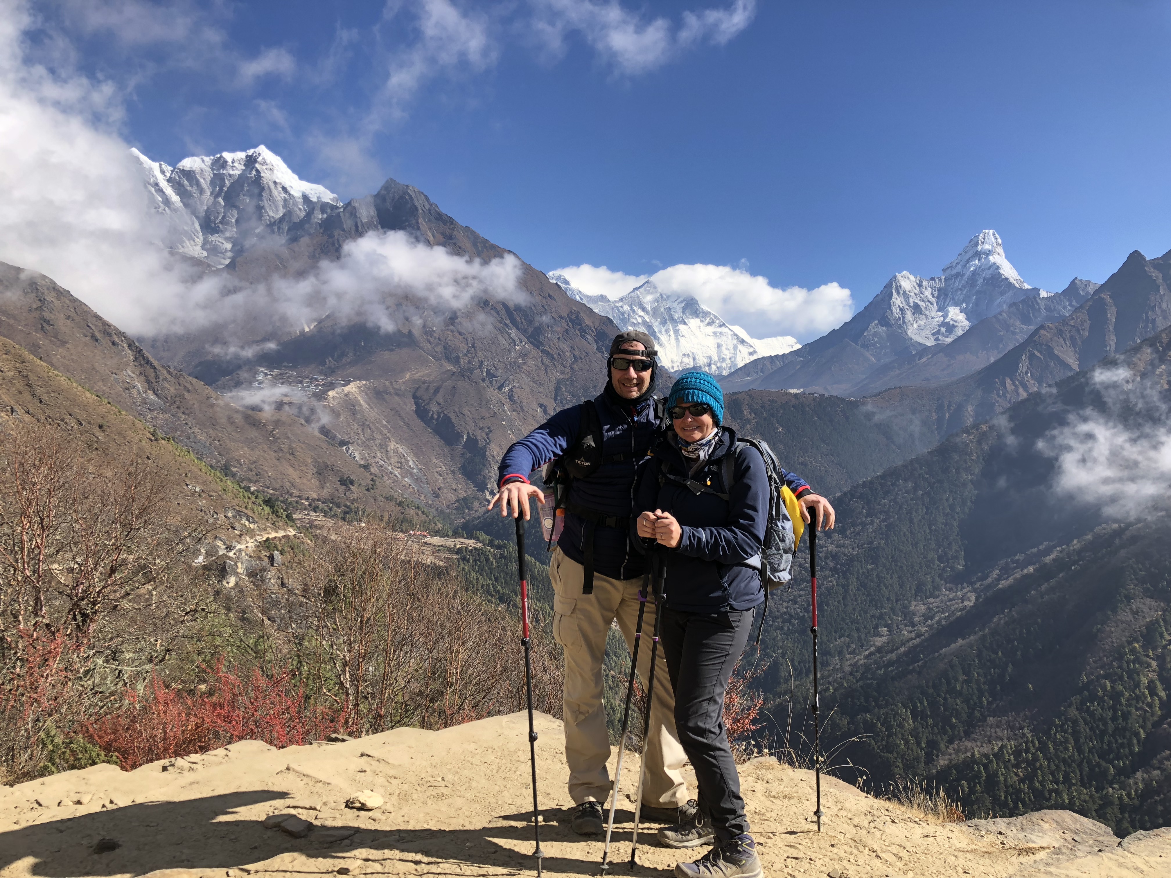 My husband and I in front of Mt Everest and other major peaks.