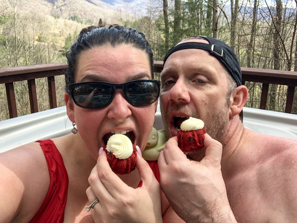 Eating cupcakes in the hot tub at our Carolina Mornings cabin.